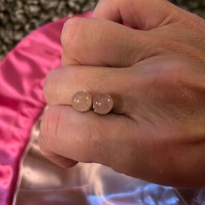 Avon light pink pierced ball earrings.